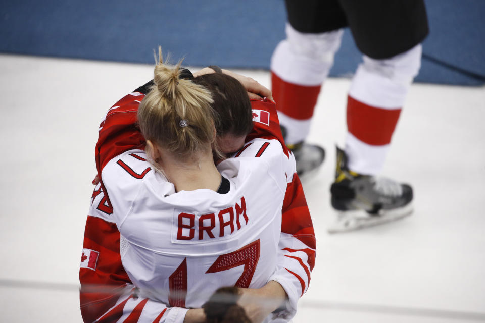 <p>Bailey Bram (17), of Canada, embraces a teammate after losing to the United States in the women’s gold medal hockey game at the 2018 Winter Olympics in Gangneung, South Korea, Thursday, Feb. 22, 2018. (AP Photo/Jae C. Hong) </p>