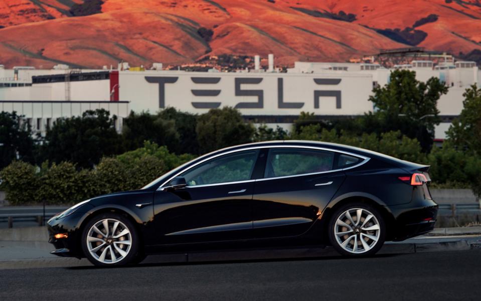 First production model of Tesla Model 3 out the assembly line in Fremont, California. REUTERS