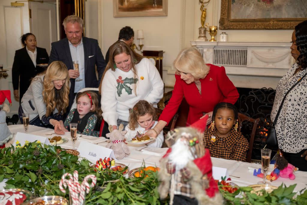 london, england december 7 her majesty, camilla, the queen consort helps to serve lunch for children at clarence house on december 7, 2022 in london, england the queen consort supported by helen douglas house and roald dahls marvellous childrens charity to decorate the christmas tree and receive a few festive surprises photo by paul grover wpa poolgetty images