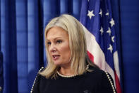 Oakland County prosecutor Karen McDonald addresses the media in her office, Friday, Dec. 3, 2021, in Pontiac, Mich. McDonald filed involuntary manslaughter charges against Jennifer and James Crumbley, the parents of 15-year-old Ethan Crumbley, who is accused of killing four students at a Michigan high school. (AP Photo/Carlos Osorio)