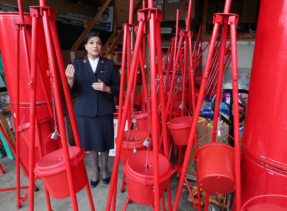 Salvation Army Capt. Anita Albert-Watson talks about the Red Kettle Campaign on Thursday at the Summit County headquarters on Maple Street in Akron.