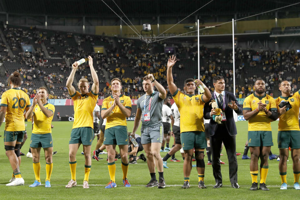 Australia's rugby team waves to the crowd after their 39-21 win over Fiji during the Rugby World Cup Pool D game at Sapporo Dome between Australia and Fiji in Sapporo, Japan, Saturday, Sept. 21, 2019. (Juntaro Yokoyama/Kyodo News via AP)