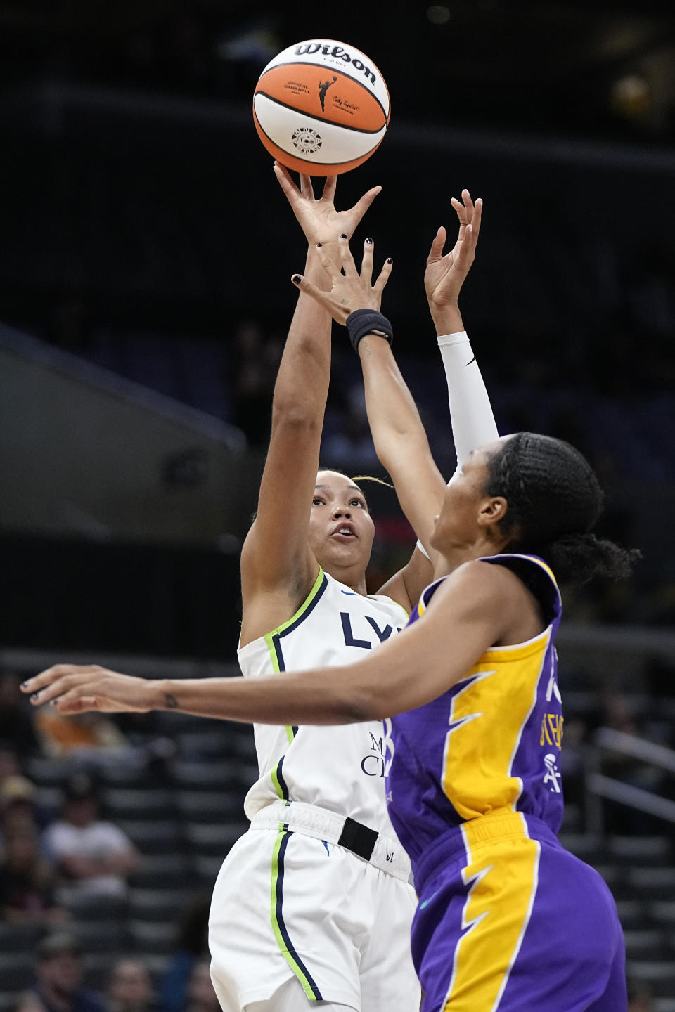 Minnesota Lynx forward Napheesa Collier, left, shoots as Los Angeles Sparks forward Azura Stevens defends during the first half of a WNBA basketball game Tuesday, June 20, 2023, in Los Angeles. (AP Photo/Mark J. Terrill)