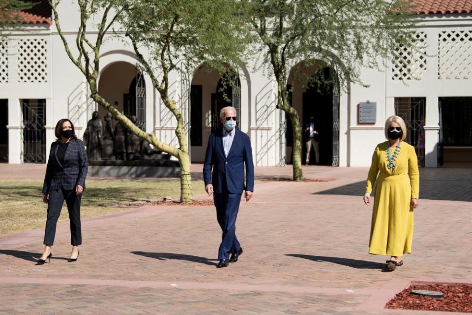 Kamala Harris, Joe Biden and Cindy McCain walk to the American Indian Veterans National Memorial at the Heard Museum, 8 October 2020, in Phoenix.