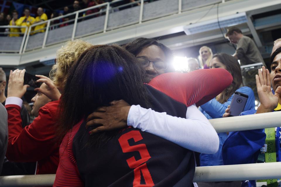 <p>Simone Manuel hugs her mom Sharron after tying for gold in the women’s 100-meter freestyle final at Rio 2016 on Thursday, August 11, 2016. (Photo by AAron Ontiveroz/The Denver Post via Getty Images) </p>
