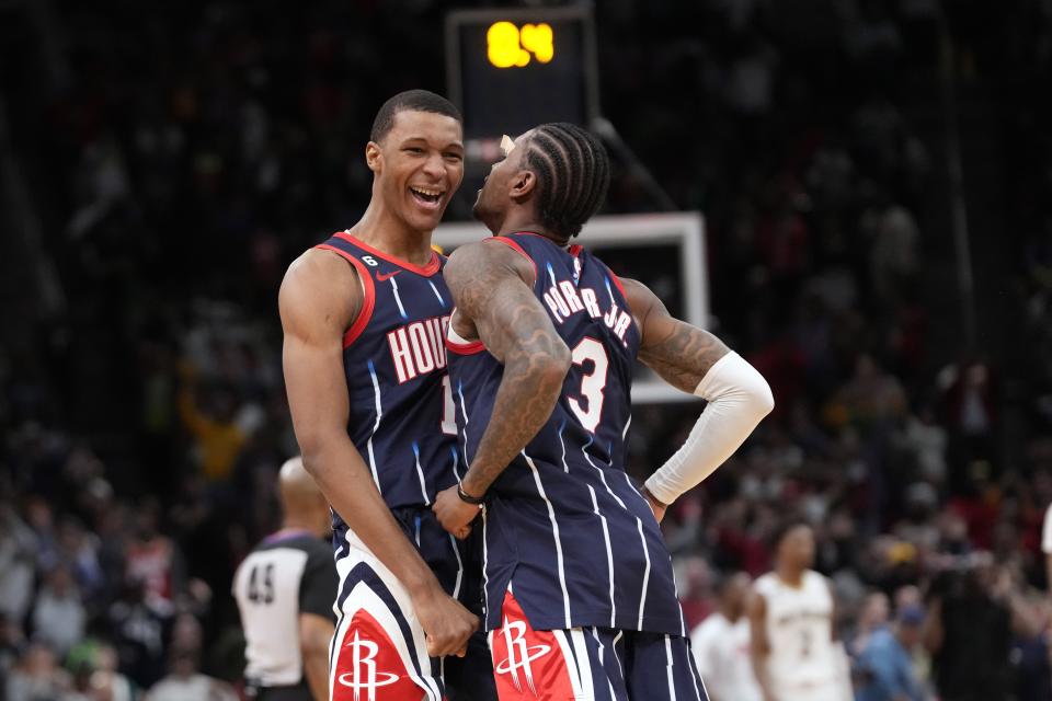 Houston Rockets' Jabari Smith Jr. (1) celebrates with Kevin Porter Jr. (3) after making a game-winning basket against the New Orleans Pelicans during the second half of an NBA basketball game Friday, March 17, 2023, in Houston. The Rockets won 114-112. (AP Photo/David J. Phillip)