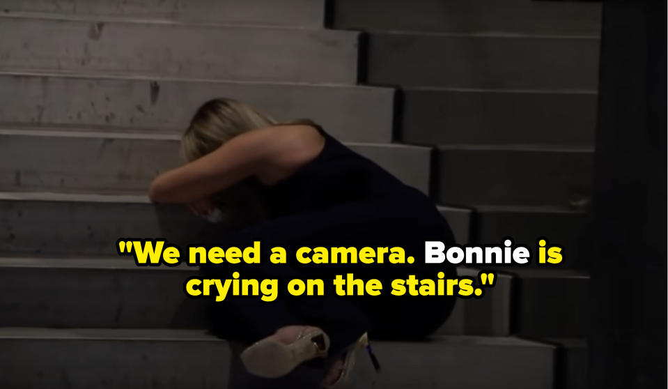 Rachel crying on the stairs after Clayton tells her he's in love with three women on "The Bachelor"
