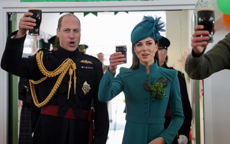 Cheers! The Prince and Princess of Wales take part in the senior guardsman's toast and enjoy a glass of Guinness - Chris Jackson/PA Wire