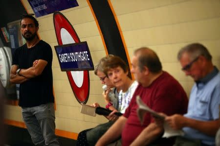 Passengers sit at Southgate Underground Station, renamed as 'Gareth Southgate' in honour of England soccer team manager Gareth Southgate, in London, Britain July 16, 2018. REUTERS/Hannah McKay