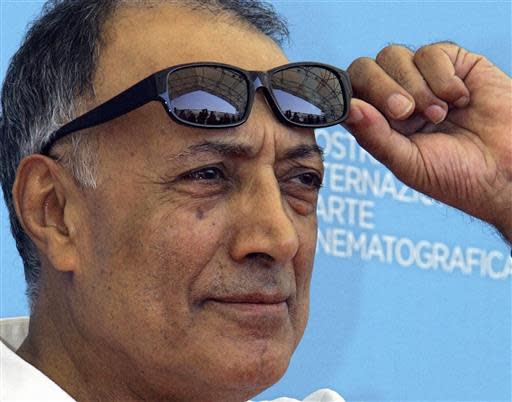 In an Aug. 28, 2008 file photo, acclaimed Iranian film director Abbas Kiarostami poses during the photo call of his movie "Shirin (My sweet Shirin)" at the 65th edition of the Venice Film Festival in Venice, Italy. Kiarostami, whose 1997 film "Taste of Cherry" won the Palme d'Or, died Monday, July 4, 2016, in Paris, where he had gone for cancer treatment. He was 76.