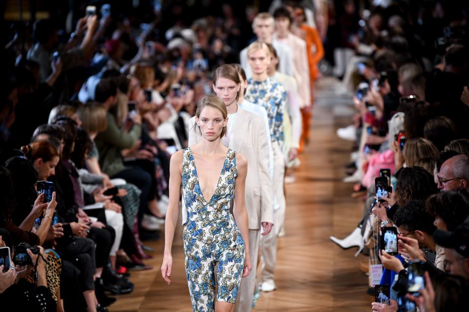 <p>Fashion is really doubling down on its surf obsession this season. Stella McCartney joined the beach party with a spring 2019 collection that was heavy on the tie dye (that Justin Bieber is a trendsetter!), wet suit-inspired body suits, and jelly-fish-esque ruffles along the hems of flouncy skirts and in zipper-detailing. Bodysuits were worn with low-slung baggy suit pants. The whole vibe was very surfer girl who DGAF. Just throw on some pants over a wet suit and a tie dye tee and you're good to go. The dressed up looks towards the end-lingerie slips and sheer floral print gowns-felt very unfussy and would go just as well with bare feet or sneakers as with heels. </p>