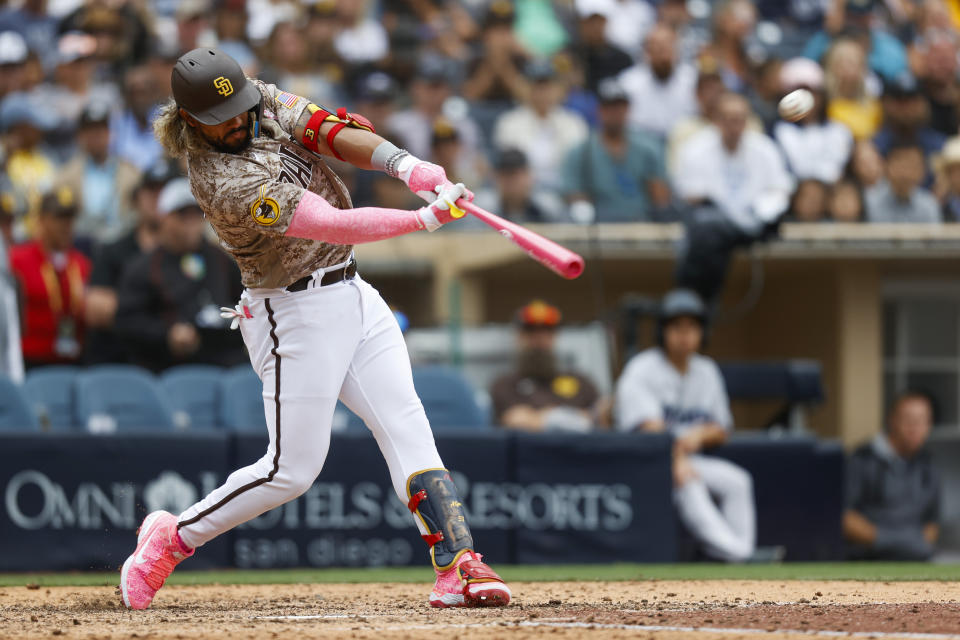 San Diego Padres' Jose Alfaro hits a three-run walkoff home run against the Miami Marlins during the ninth inning of a baseball game Sunday, May 8, 2022, in San Diego. (AP Photo/Mike McGinnis)