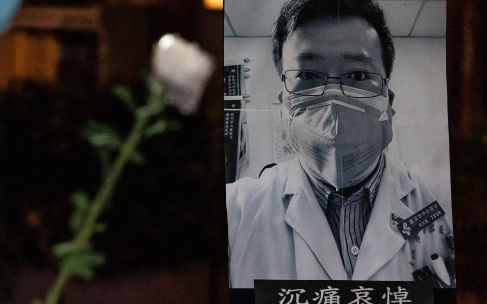 People attend a vigil to mourn for doctor Li Wenliang on February 7, 2020 in Hong Kong