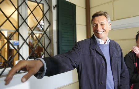 Presidential candidate Borut Pahor reacts as he talks to the media during the presidential election outside a polling station in Sempeter pri Novi Gorici, Slovenia October 22, 2017. REUTERS/Srdjan Zivulovic