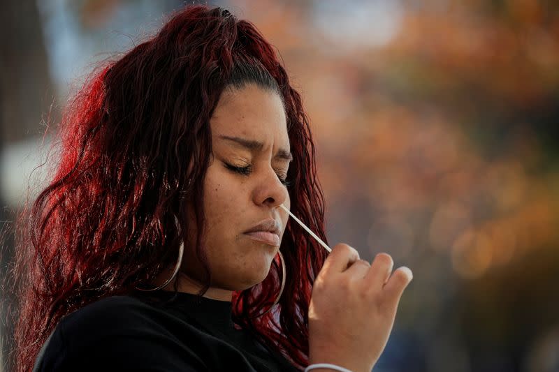 A woman takes a test for the coronavirus disease (COVID-19) in Staten Island, New York