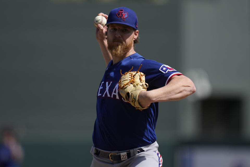 Texas Rangers starting pitcher Jon Gray (22) throws during the first inning of a spring training baseball game against the Arizona Diamondbacks in Scottsdale, Calif., Wednesday, March 8, 2023. (AP Photo/Ashley Landis)