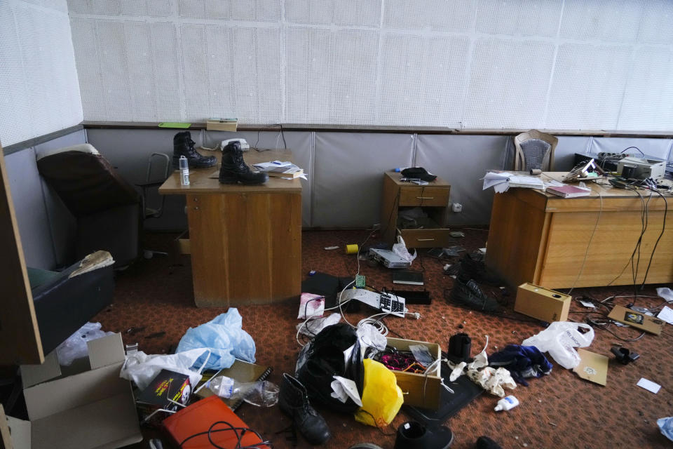 A state office building near the Chernobyl nuclear power plant is scattered with debris after Russians soldiers hurriedly left in Chernobyl, Ukraine, Saturday, April 16, 2022. Thousands of tanks and troops rumbled into the forested exclusion zone around the plant in the earliest hours of Russia’s invasion of Ukraine in February, churning up highly contaminated soil from the site of the 1986 accident that was the world's worst nuclear disaster. (AP Photo/Efrem Lukatsky)