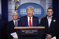 President Donald Trump speaks as Vice President Mike Pence, left, and FEMA Administrator Peter Gaynor look on, during a coronavirus task force briefing at the White House, Sunday, March 22, 2020, in Washington. (AP Photo/Patrick Semansky)