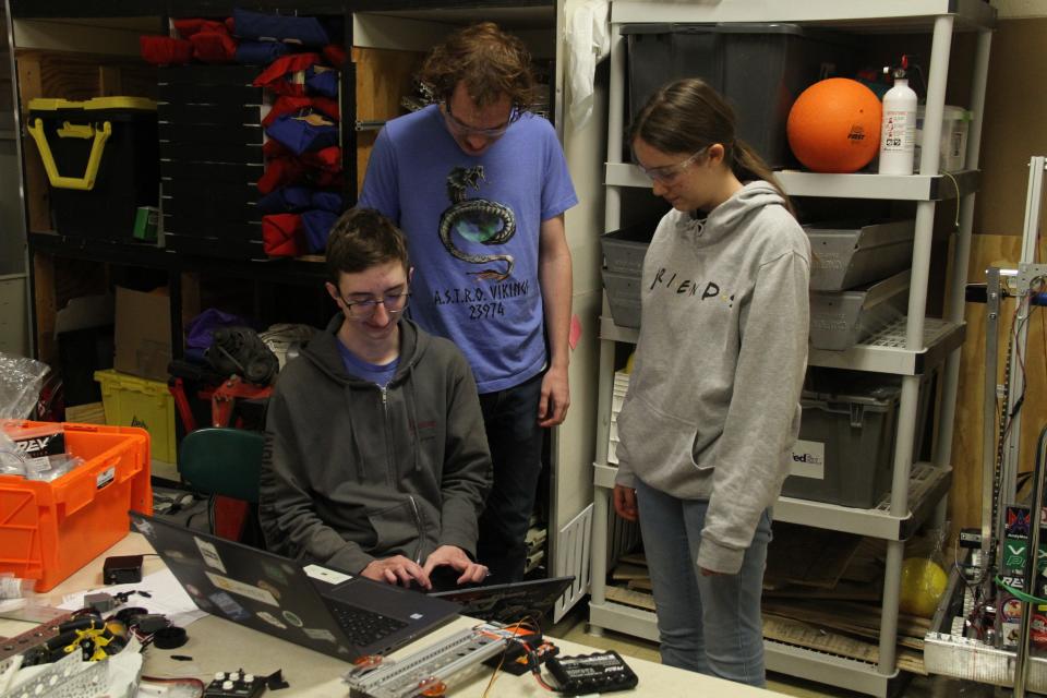 Members of the A.S.T.R.O Vikings work on their robot for Worlds competition in Houston in April, a little under three weeks away.