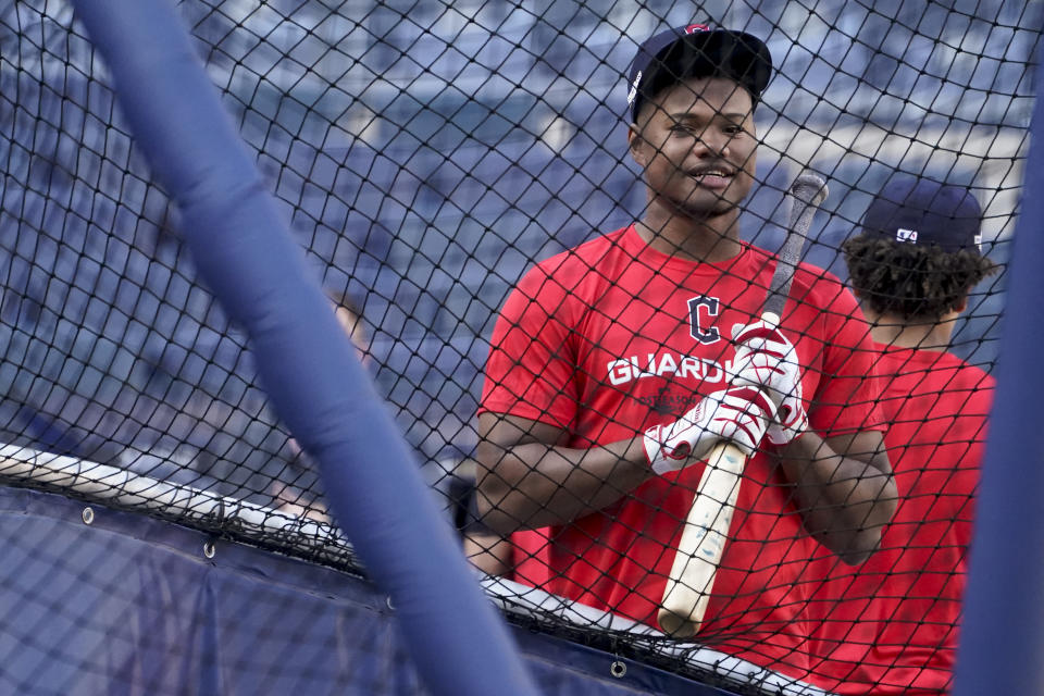 Cleveland Guardians' Oscar Gonzalez waits to bat during a workout ahead of Game 1 of baseball's American League Division Series against the New York Yankees, Monday, Oct. 10, 2022, in New York. (AP Photo/John Minchillo)