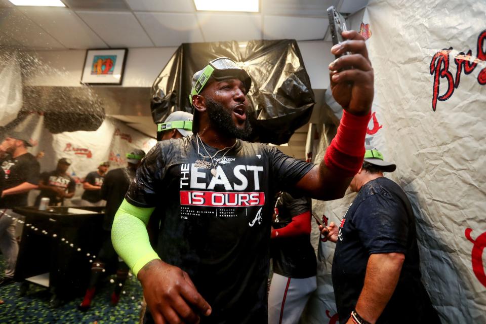 MIAMI, FLORIDA - OCTOBER 04: Marcell Ozuna #20 of the Atlanta Braves celebrates after the Braves clinched the division against the Miami Marlins at loanDepot park on October 04, 2022 in Miami, Florida. (Photo by Megan Briggs/Getty Images)