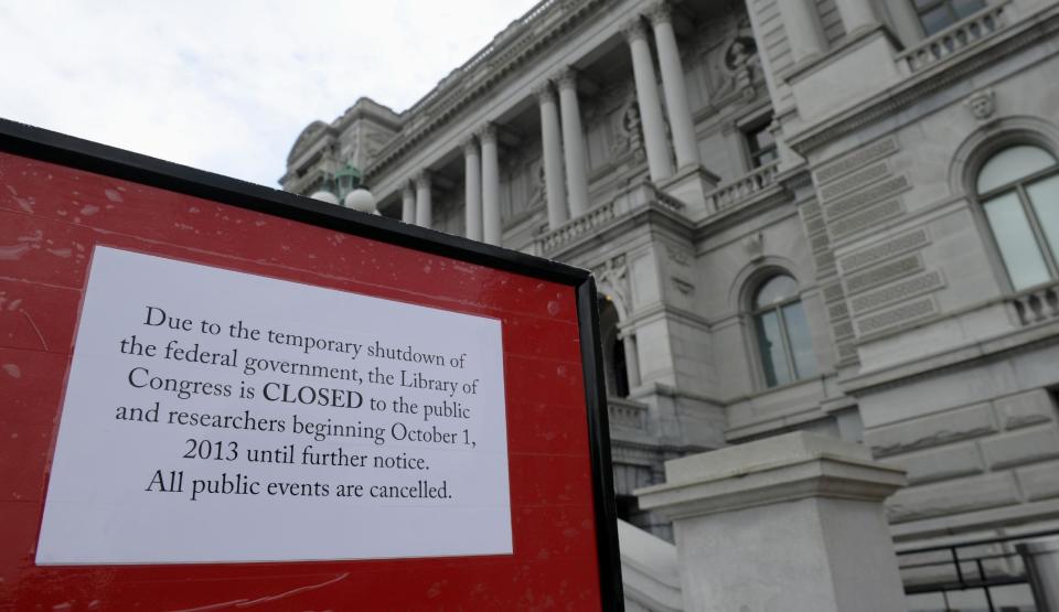 A sign explaining the closing of the Library of Congress is posted outside the Library of Congress in Washington, Tuesday, Oct. 1, 2013. Congress plunged the nation into a partial government shutdown Tuesday as a long-running dispute over President Barack Obama's health care law stalled a temporary funding bill, forcing about 800,000 federal workers off the job and suspending most non-essential federal programs and services. (AP Photo/Susan Walsh)