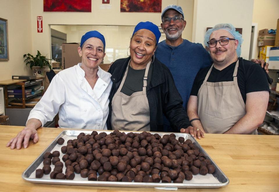 Renee Faubert, left, is accommodating Chocolate Therapy inside her Natick business, Renee's Kitchen, until the chocolate shop reopens its own retail space in Wayland. From left are Faubert; Pam and David Griffin, owners of Chocolate Therapy; and Rick Gemme, chocolatier at Chocolate Therapy.