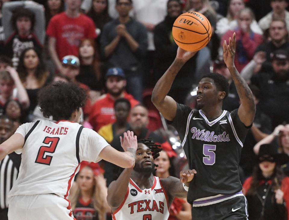 Kansas State guard Cam Carter (5) looks for an open teammate Saturday against Texas Tech at United Supermarkets Arena in Lubbock, Texas.