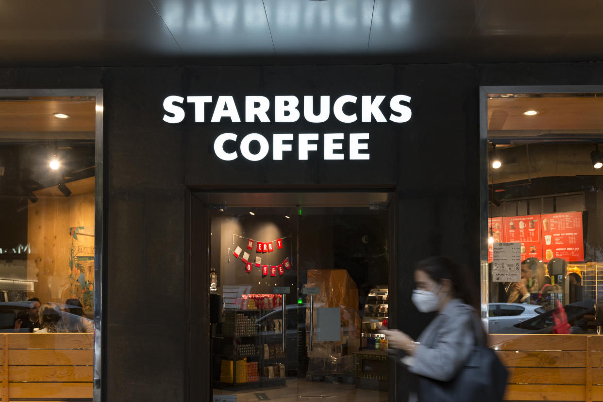 Starbucks Coffee shop seen with Black Friday stickers during the heavy rain. (Photo by Xisco Navarro/SOPA Images/LightRocket via Getty Images)