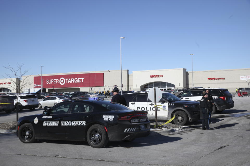 Law enforcement personnel work at the scene outside a west Omaha Target store, Tuesday, Jan 31, 2023, in Omaha, Neb., where officers killed a man armed with an AR-15 style rifle. (AP Photo/Josh Funk) (AP Photo/Josh Funk)
