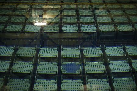 A view shows the pool storage where spent nuclear fuel tanks are unload in baskets under 4 meters of water to decrease temperature as part of the treatment of nuclear waste at the Areva Nuclear Plant of La Hague, near Cherbourg, western France, April 22, 2015. REUTERS/Benoit Tessier