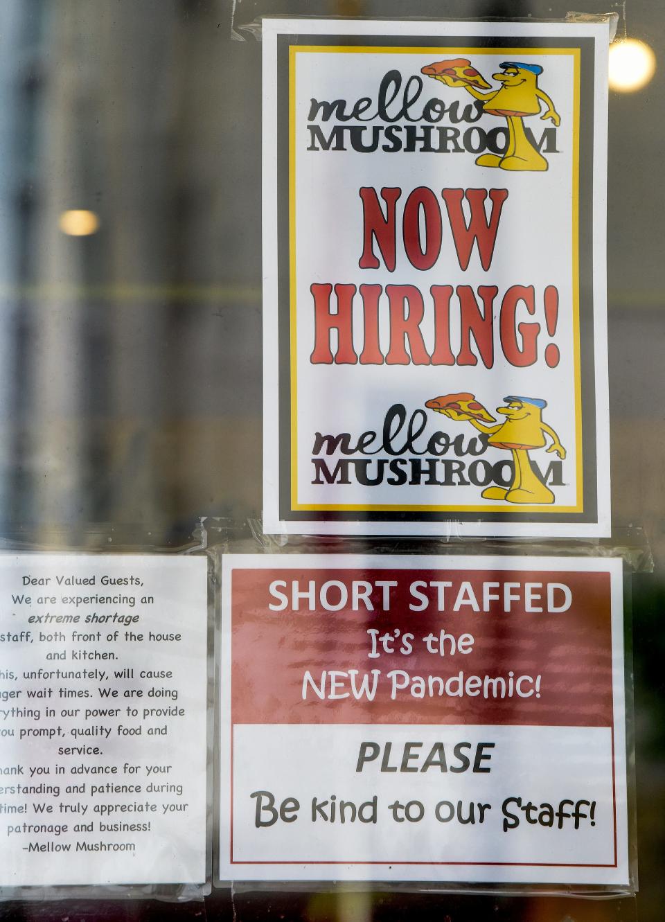 Signs in the window of Mellow Mushroom in downtown Montgomery, Ala., on Monday announce that the restaurant is short-staffed and hiring.