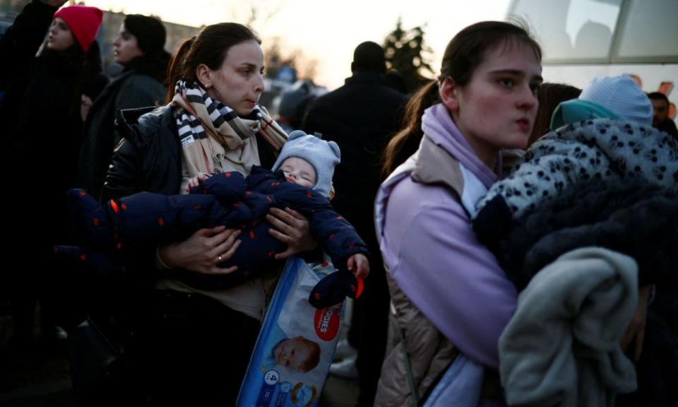 Mothers and children fleeing Ukraine arrive at a temporary camp in Przemysl, Poland.