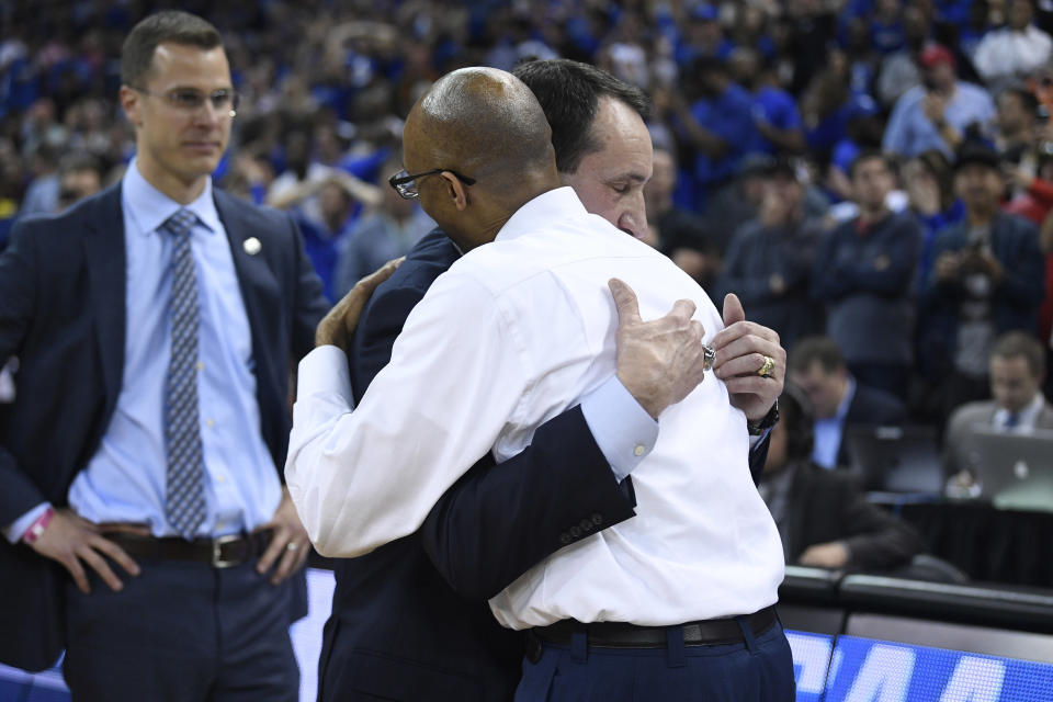COLUMBIA, SC - MARCH 24: Head coach Mike Krzyzewski of the Duke Blue Devils and head coach Johnny Dawkins of the UCF Knights embrace after their game in the second round of the 2019 NCAA Men's Basketball Tournament held at Colonial Life Arena on March 24, 2019 in Columbia, South Carolina. (Photo by Grant Halverson/NCAA Photos via Getty Images)