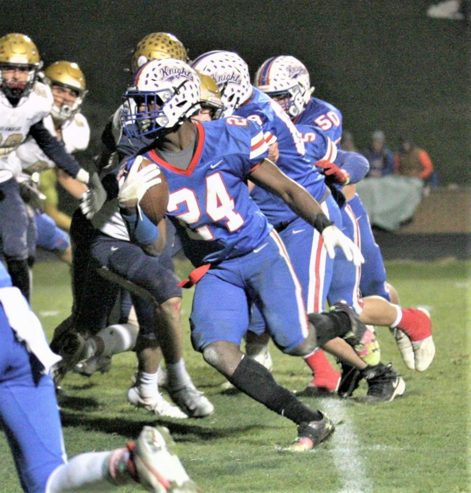 Sam Williams-Dixon looks for daylight against Tiffin-Columbian. Williams-Dixon carried the ball 31 times for 176 yards and four touchdowns to lead West Holmes to victory.