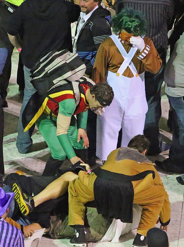 An Oompa Loompa looks worried as spectators erupt into violence at the Invitational Darts Challenge in Melbourne. Photo: Getty