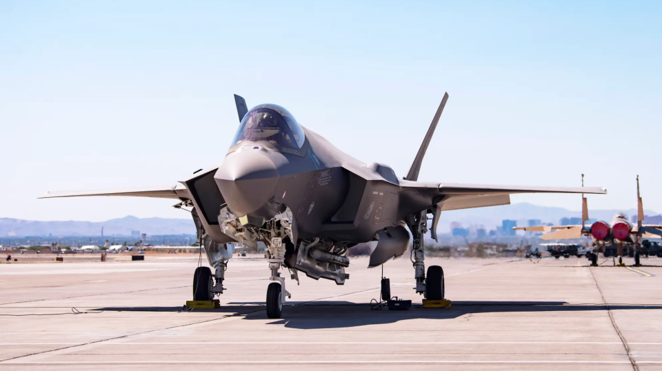 An F-35A carrying a B61-12 Joint Test Assembly sits on the flight line at Nellis Air Force Base, Nevada, on September 21, 2021. The bomb itself is not visible, but the jet also carries a pair of AIM-120 AMRAAM air-to-air missiles in its weapons bays. <em>U.S. Air Force/Airman 1st Class Zachary Rufus</em><br>