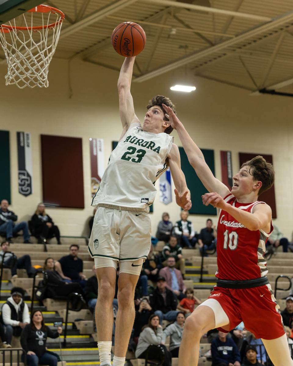 Aurora senior Cooper Carnahan goes up for a dunk against Crestwood.