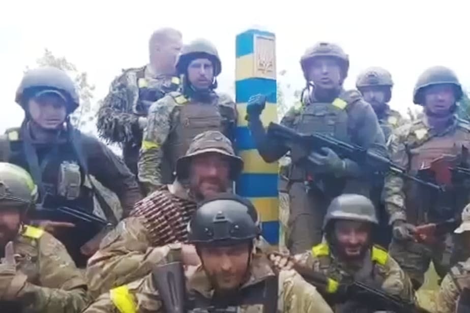 Ukrainian soldiers appear at the border of Russia in a video posted to the Ukrainian Defense Ministry's official Telegram account. (Ukrainian Defense Ministry)