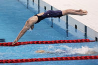 Japanese swimmer Rikako Ikee takes off to swim during a demonstration as part of a grand opening ceremony of Tokyo Aquatics Center Saturday, Oct. 24, 2020, in Tokyo. The Tokyo 2020 organizing committee held the grand opening ceremony Saturday at the aquatics center, planned to host Olympic artistic swimming, diving and swimming and Paralympics swimming events in 2021. (AP Photo/Eugene Hoshiko)