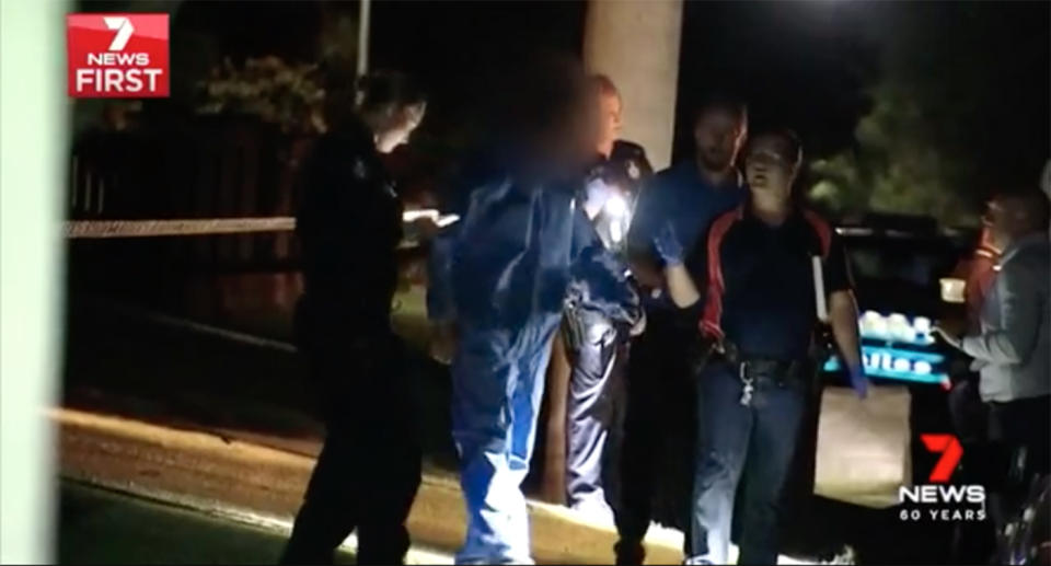 An identified man was placed in a forensic suit and spoken to by detectives at the scene Monday night. No arrests have been made. Source: 7 News