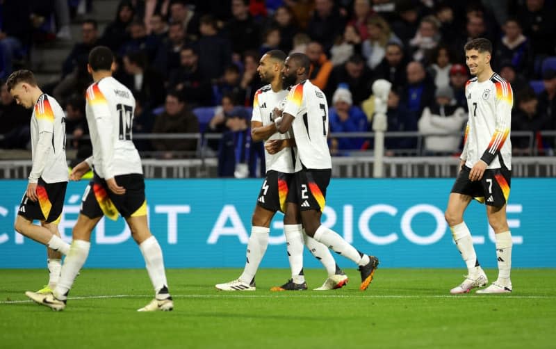 Germany's Kai Havertz (R) celebrates his goal with his team-mates during the International friendly soccer match between France and Germany at Groupama Stadium. Christian Charisius/dpa