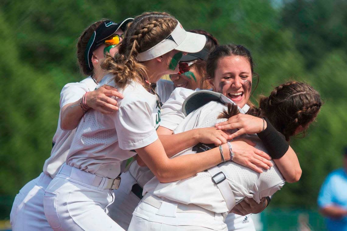 Peninsula starter Alli Kimball celebrates with teammates following a shutout win over Bonney Lake in the Class 3A West Central/Southwest district softball championship game on Saturday, May 20, 2023 at the Regional Athletic Complex in Lacey, Wash.