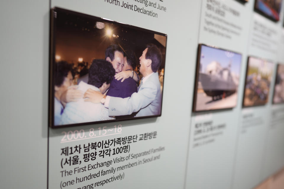 A picture of South and North Korean families' reunion is displayed at the exhibition hall of the unification observatory in Paju, South Korea, Thursday, Sept. 8, 2022. South Korea's new government on Thursday proposed a meeting with North Korea to resume reunions of families separated since the 1950-53 Korean War, despite long-strained ties between the rivals over the North's nuclear weapons program. (AP Photo/Lee Jin-man)