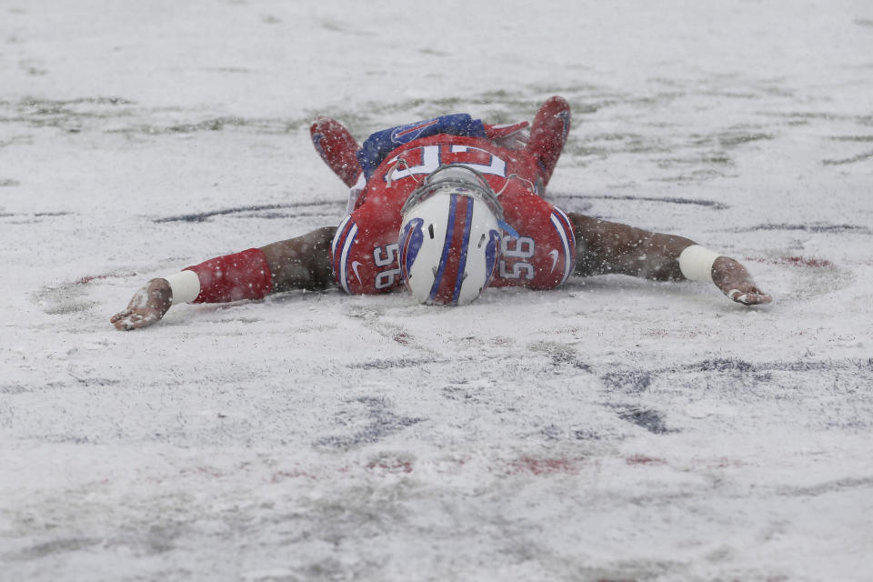 Buffalo Bills’ Ryan Davis makes a snow angel on the field before his team hosted the Indianapolis Colts. (AP)