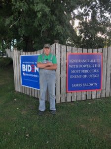 John Rosenow with his Biden and James Baldwin signs (photo by Ruth Conniff).