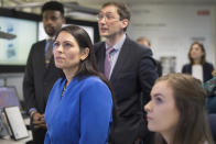 Britain's Home Secretary Priti Patel meets students and staff working on 'carbon capture' at Imperial College London in South Kensington, London, Tuesday Feb. 18, 2020. Britain has announced a new post-Brexit “points-based immigration system” said Patel, that will assess prospective immigrants on a range of skills, qualifications, salaries or professions, starting next year. (Stefan Rousseau/PA via AP)