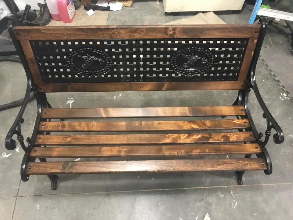 The bench after with new slats and a walnut wood stain