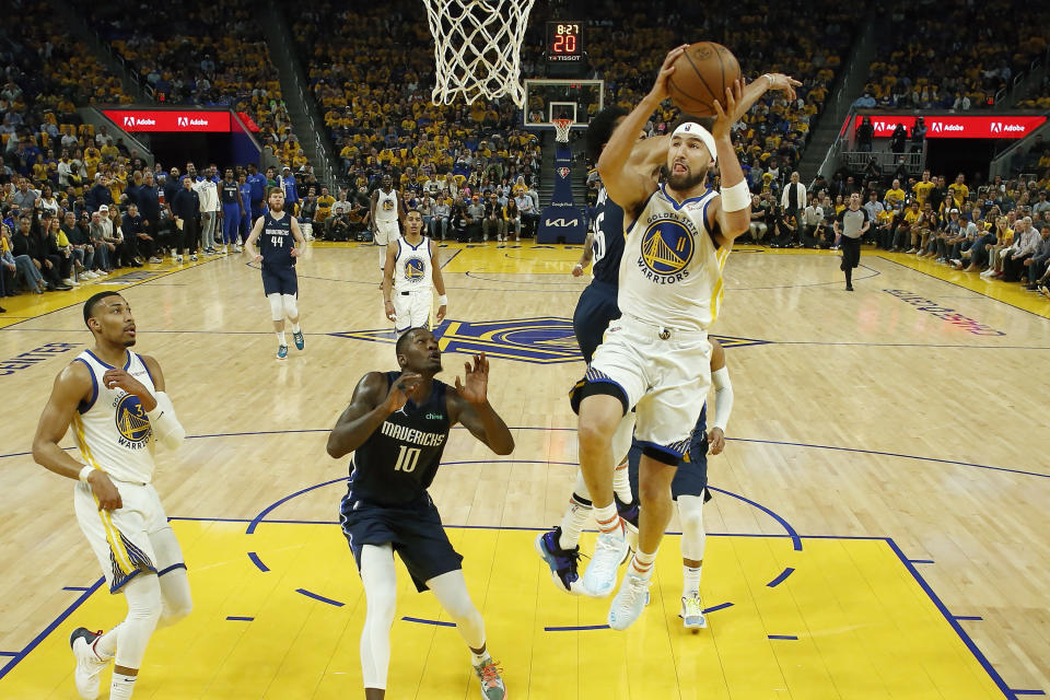 Golden State Warriors guard Klay Thompson (11) shoots against the Dallas Mavericks during the first half of Game 2 of the NBA basketball playoffs Western Conference finals in San Francisco, Friday, May 20, 2022. (AP Photo/Jed Jacobsohn)