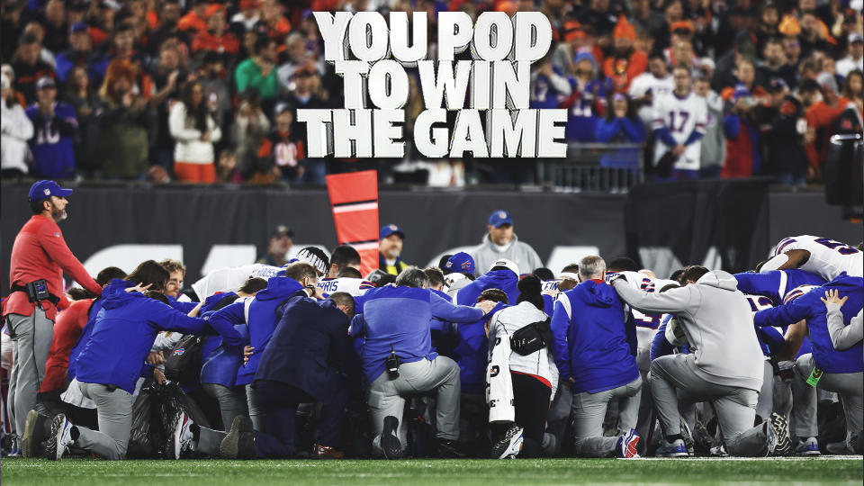 Buffalo Bills players and staff kneel and huddle around safety Damar Hamlin, who was critically injured during Monday night's game against the Cincinnati Bengals. (Photo by Kevin Sabitus/Getty Images)